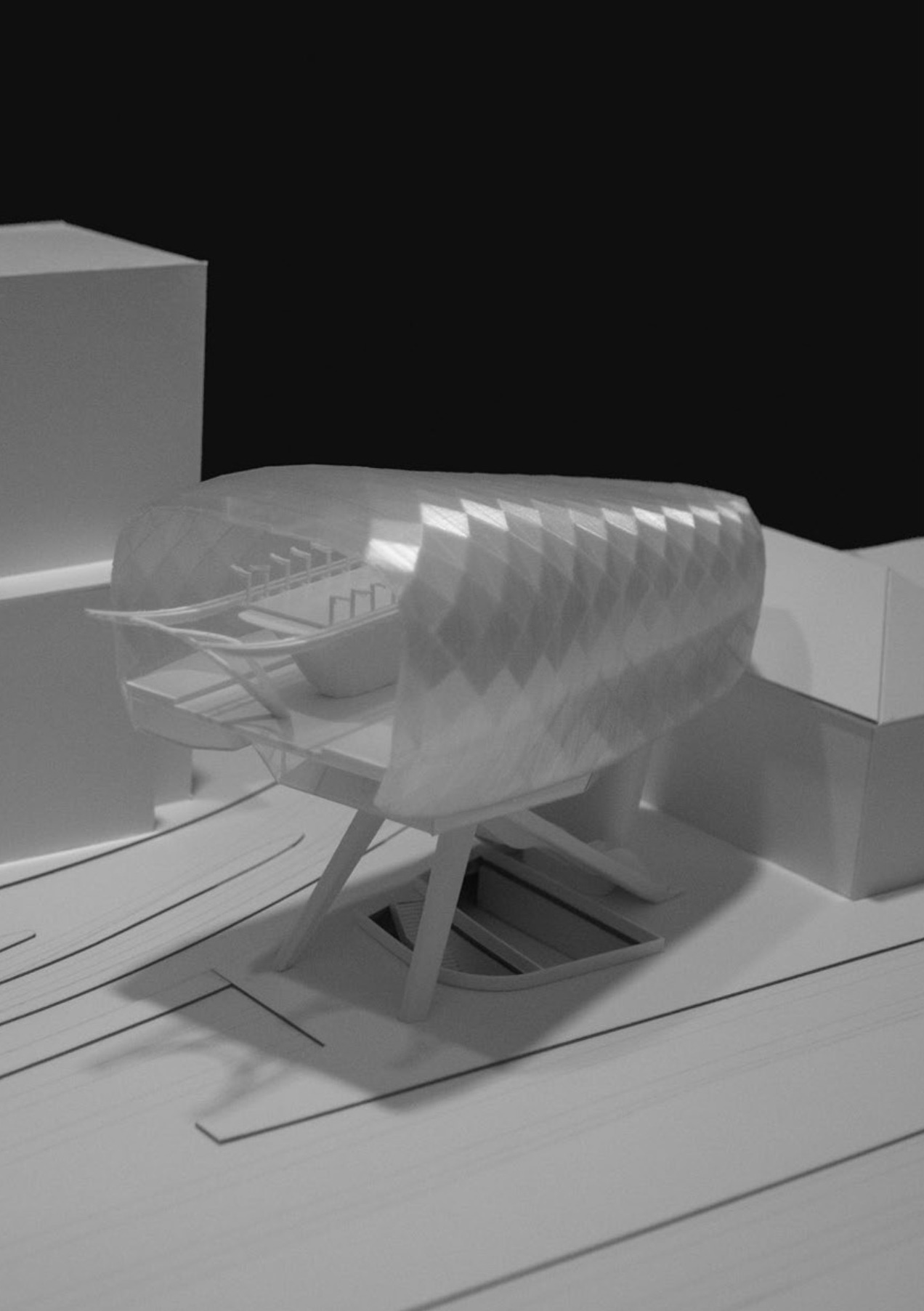 Physical model of the elevated cable car station with translucent shell and support structure.