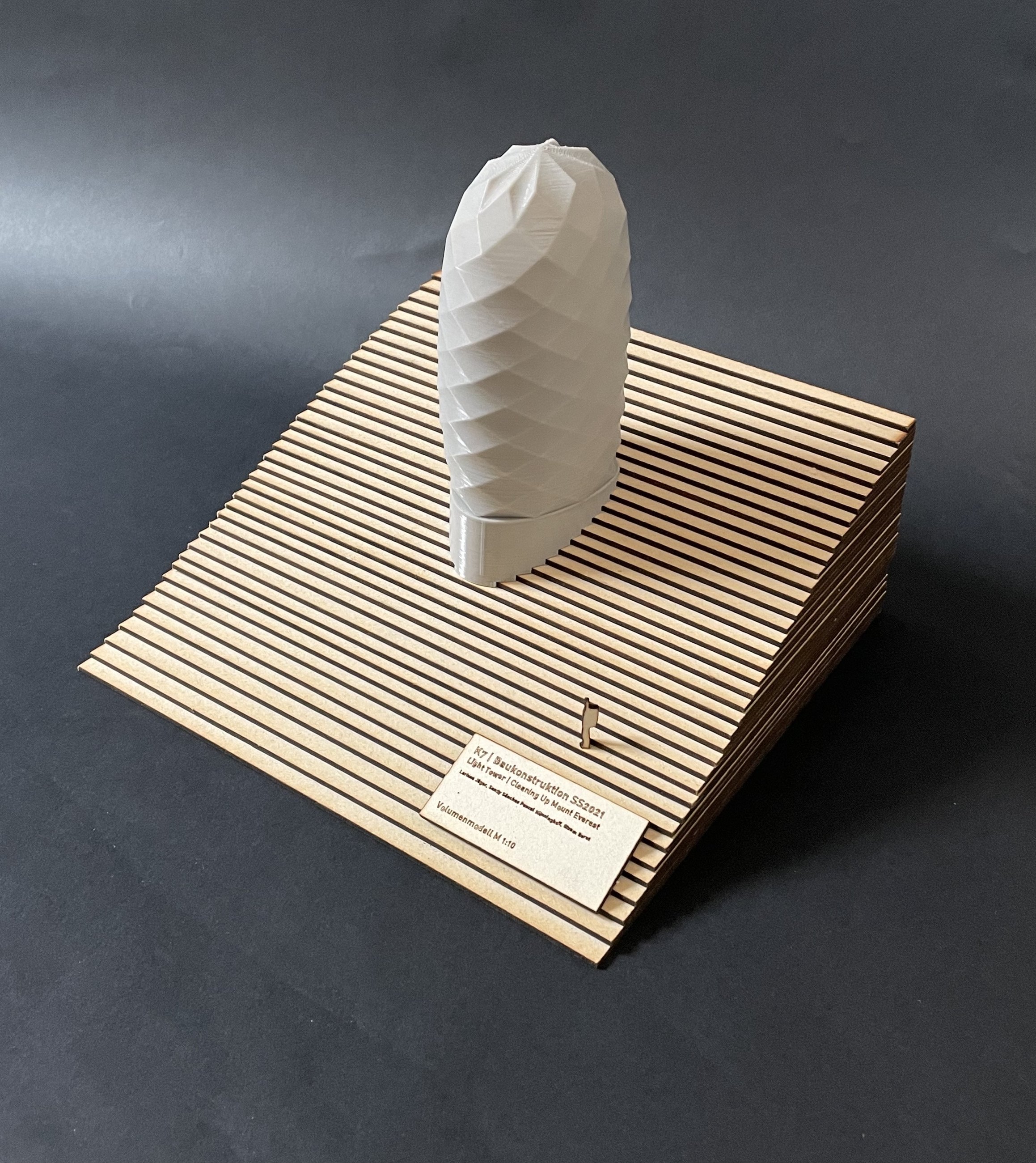 Physical model of the Light Tower exterior on a layered terrain base.