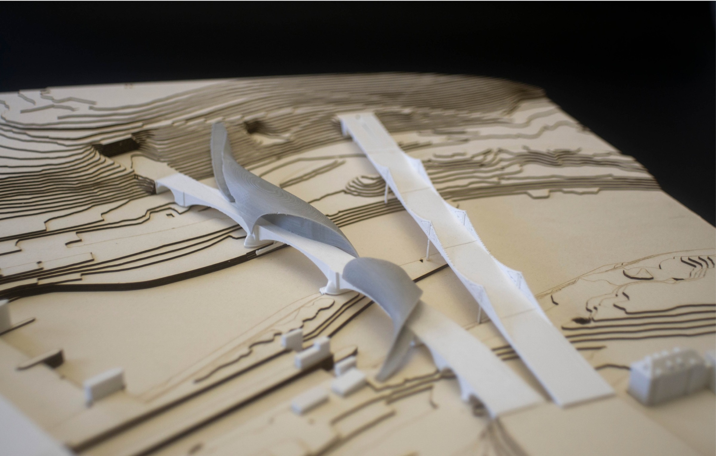 Physical model view of the bridge intervention and its relationship to the existing crossing.